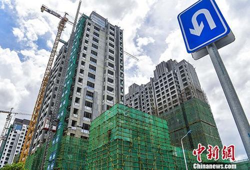 资料图：正在建设的楼房。 <a target='_blank' href='http://www.chinanews.com/'>中新社</a>记者 骆云飞 摄