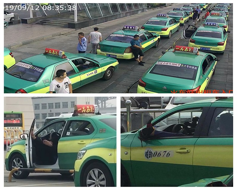 襄阳火车站(东站)出租车通道内多位出租车驾驶员在候客时聚集闲谈
