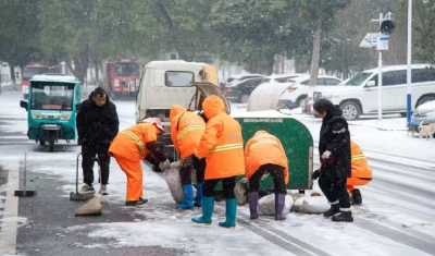 荆州江陵：雪映志愿红 暖透创文路