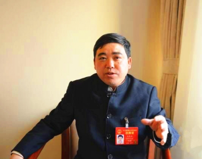 王光国建议必须加快少数民族贫困地区交通发展 