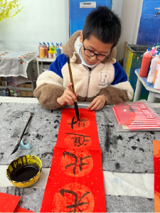 【全民写春联】张家三巷小学温昱程：挥毫书春意，墨韵贺马年