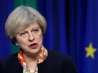 英议会通过脱欧法案引抗议 首相称月底前启动脱欧