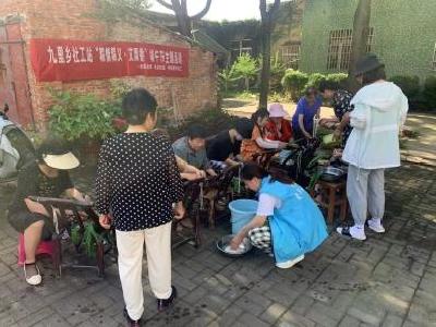 以粽会邻 乐享生活——九里回族乡社工站开展“粽情粽义·艾飘香”端午节主题活动
