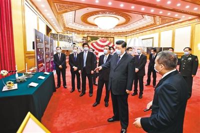 习近平在会见探月工程嫦娥五号任务参研参试人员代表并参观月球样品和探月工程成果展览时强调 勇攀科技高峰 服务国家发展大局 为人类和平利用太空作出新的更大贡献