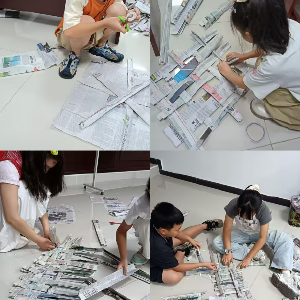 旧报巧裁焕新彩 童心创想传环保