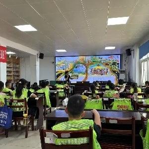 新港苑社区开展青少年暑期托管班亲子阅读活动