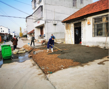 兴农社区：道路维修解民忧，铺设路面暖民心