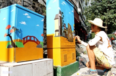 市城管执法局：箱体“涂鸦”打造城区美丽街景